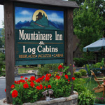 MOUNTAINAIRE INN &
LOG CABINS